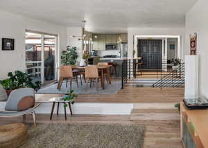 Dining room with a chandelier and light wood-type flooring