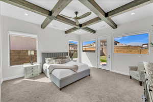 Bedroom featuring access to outside, beam ceiling, and light colored carpet