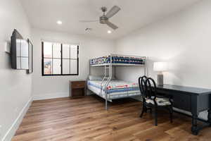 Bedroom featuring ceiling fan, recessed lighting, wood finished floors, visible vents, and baseboards