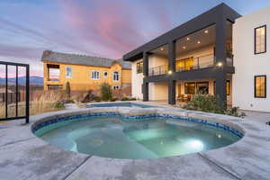 View of pool featuring an in ground hot tub and a patio area