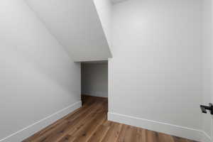 Interior space featuring baseboards and wood finished floors