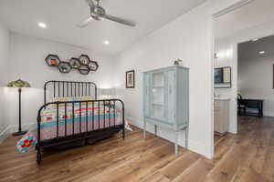 Bedroom featuring recessed lighting, wood finished floors, and baseboards