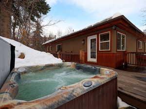 Exterior space featuring a hot tub