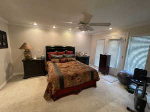 Bedroom featuring ornamental molding, recessed lighting, and light carpet