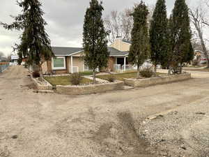 View of front of property featuring fence