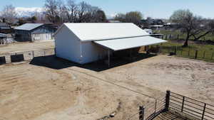 Exterior space featuring an exterior structure, an outdoor structure, and driveway