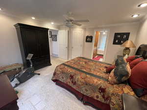 Bedroom with ornamental molding, recessed lighting, visible vents, and light carpet