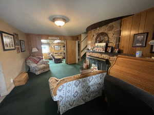 Bedroom featuring carpet and wooden walls