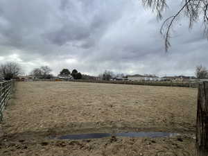 View of yard featuring fence