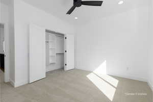 Unfurnished bedroom featuring recessed lighting, light colored carpet, and baseboards