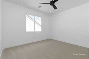 Empty room with recessed lighting, light colored carpet, visible vents, ceiling fan, and baseboards