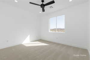 Empty room with light carpet, baseboards, visible vents, and recessed lighting