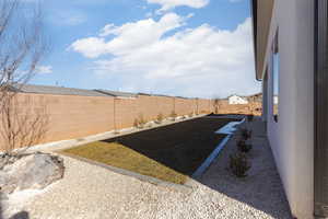 View of yard with a patio area and a fenced backyard