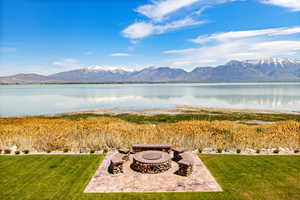 View of Utah Lake with an outdoor fire pit and mountain views