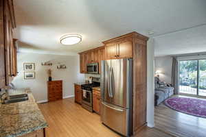 Kitchen featuring stainless steel appliances, granite countertops