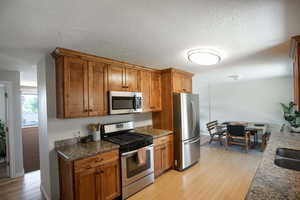 Kitchen featuring stainless steel appliances, granite countertops