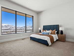 Carpeted bedroom featuring visible vents, baseboards, a mountain view, and recessed lighting