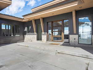 Entrance to property with stone siding