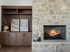 Room details with a fireplace and wood finished floors