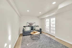 Sitting room featuring recessed lighting, french doors to the backyard, and wood finished floors