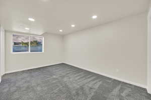 Bedroom with new carpet and recessed lighting