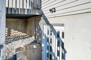 Basement entrance featuring french doors for easier access with furniture