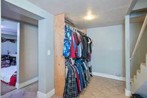 Spacious closet with tile patterned floors