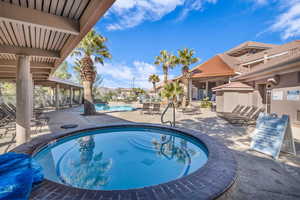 Community pool with a patio