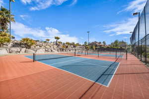 View of sport court with community basketball court and fence