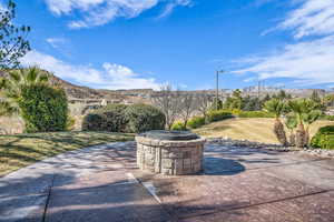 View of patio / terrace with an outdoor fire pit and a mountain view