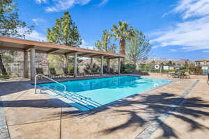 Pool featuring a patio area, fence, and a mountain view