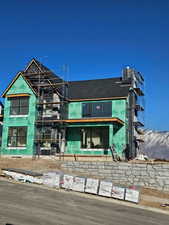 View of front of house featuring central AC unit