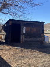 View of outdoor structure featuring an outbuilding