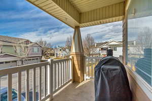 Balcony with a residential view and a grill