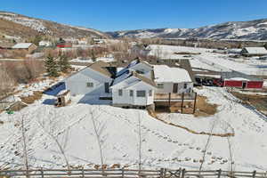 Snowy aerial view with a mountain view