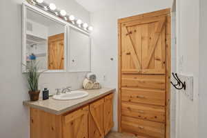 Bathroom featuring vanity, visible vents, and tile patterned floors