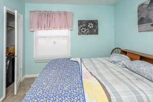 Carpeted bedroom with baseboards