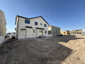 View of front of house with stucco siding