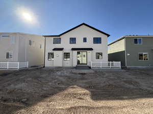 Back of house with stucco siding