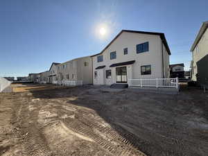 Back of property with stucco siding