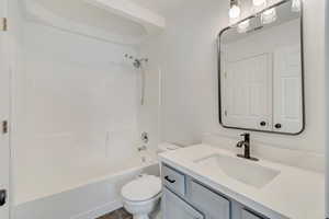 Full bath with toilet, shower / bathtub combination, visible vents, and vanity
