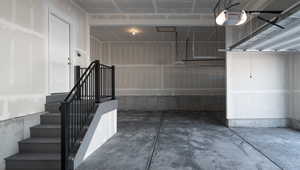 Garage featuring a garage door opener