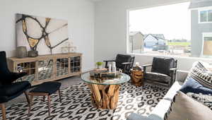 Living room featuring carpet and baseboards