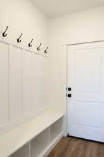 Mudroom with dark wood finished floors