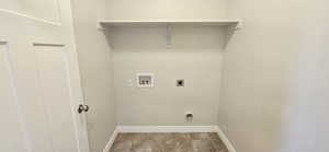 Laundry room with laundry area, hookup for a washing machine, carpet, electric dryer hookup, and baseboards