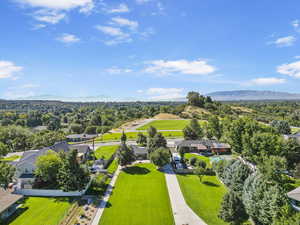 Birds eye view of property featuring a residential view and a mountain view