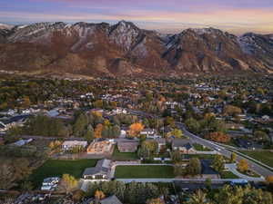 Aerial view at dusk featuring a residential view and a mountain view