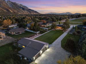 Aerial view at dusk featuring a mountain view