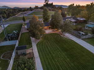 Aerial view at dusk featuring a mountain view