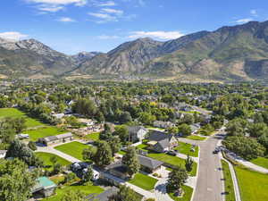 Birds eye view of property with a residential view and a mountain view